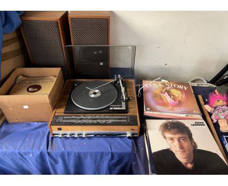 A Garrard 6 300 record player and radio gram, together with assorted records  