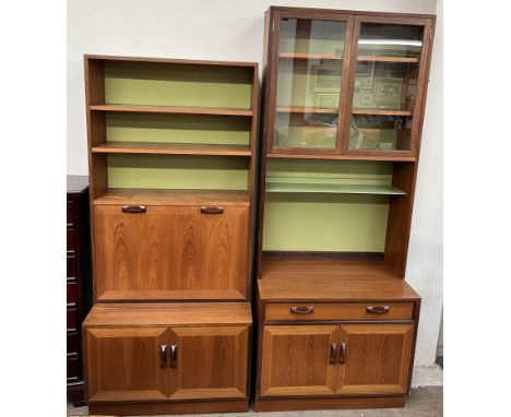 Two G-Plan teak wall units, one with shelves, drinks cabinet and cupboard doors, the other with a pair of glazed doors, shelf