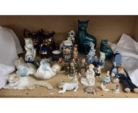 Poole pottery cats together with Hummel figures, Nao cat figures, copper lustre jugs, Nora Welling doll, etc 