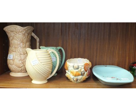 A Kensington Ware 'Sunflower' jug, 23cm high, two Wade jugs no.407, a SylvaC shell-decorated small planter pattern 4161, othe