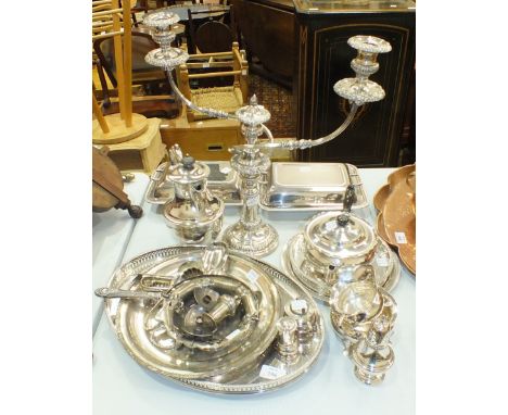 Two plated entrée dishes, a three-piece plated tea service, a three-light candelabrum and other platedware.