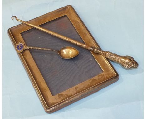 A silver rectangular photograph frame of plain form, 19.5 x 14.5cm, Birmingham 1922, a silver teaspoon with enamel plaque 'Ug