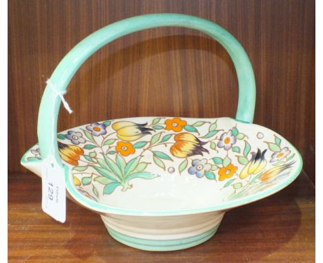 A Bursley Ware Charlotte Rhead ceramic basket decorated with stylised flowers, 23cm wide, 20cm high.