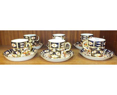 Six each Royal Crown Derby 'Imari' decorated coffee cans and saucers, pattern 2451.