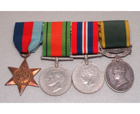 WORLD WAR II GROUP OF FOUR MEDALS AWARDED TO J. COMD. J. WRAITH, A.T.S., COMPRISING THE 1939-45 STAR, DEFENCE MEDAL, WAR MEDA