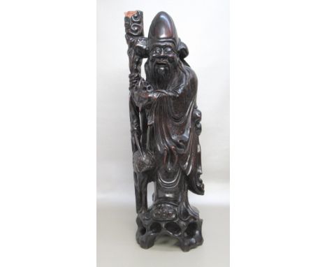 CHINESE CARVED EBONISED HARD WOOD FIGURE OF SHOU XING, A STORK BY HIS SIDE WITH ALL-OVER INLAID WIRE DECORATION, ADAPTED TO A