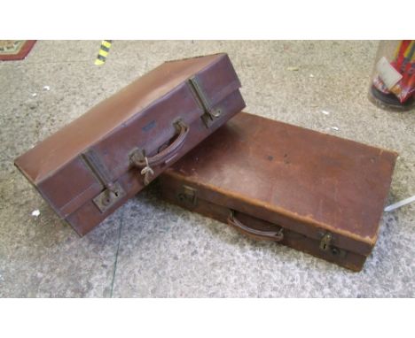 Two vintage brown leather suitcases: 