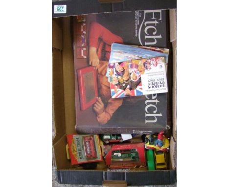 A collection of toy cars and trucks: together with a boxed etch a sketch 