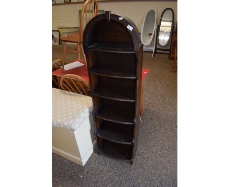 A stained pine arch topped bookcase