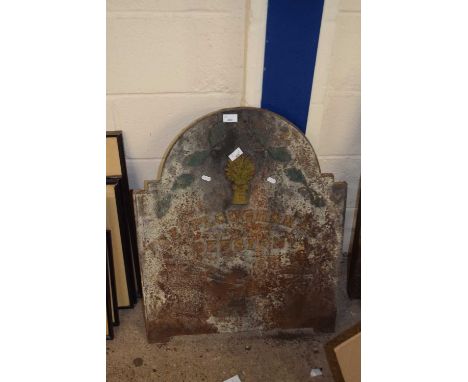 A cast iron fire back marked The Plough Share, Beeston