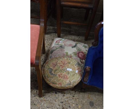 An embroidered footstool with a cushion