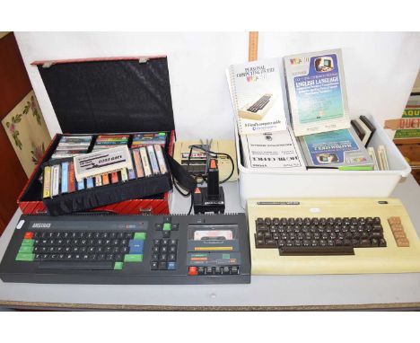 An Amstrad personal computer with a Commodore Vic 20 keyboard and various accessories for the Vic 20