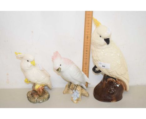 Three ceramic models of parakeets and parrots, one Royal Dux example together with two further