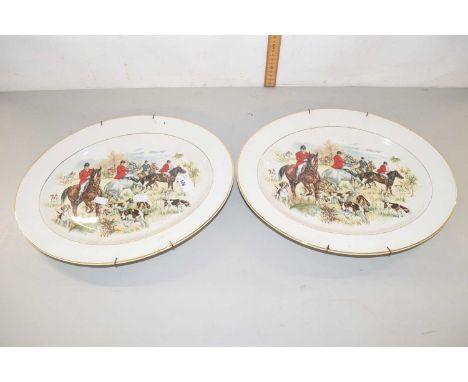 Two large serving dishes decorated with hunting scenes