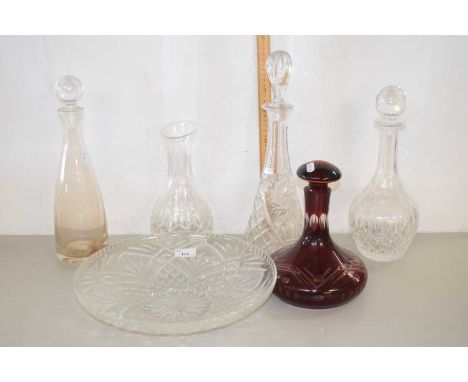 Quantity of cut glass decanters including an amber coloured ships decanter, large glass serving dish etc