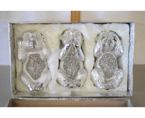 Box containing three ceramic wise monkies