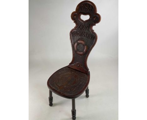HMS FOUDROYANT; an oak chair carved from timber from the famous vessel with dates 1798-1897 to both the backrest and seat and