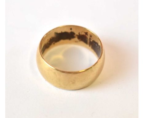 A broad 9ct yellow gold wedding band, size R, approx 7.78g.