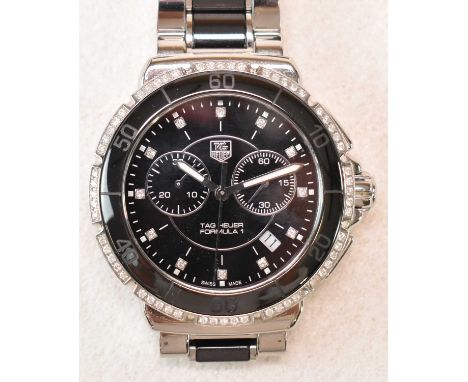 TAG HEUER; a gentleman's stainless steel Formula 1 wristwatch, with factory set diamond bezel and hour markers, ceramic detai