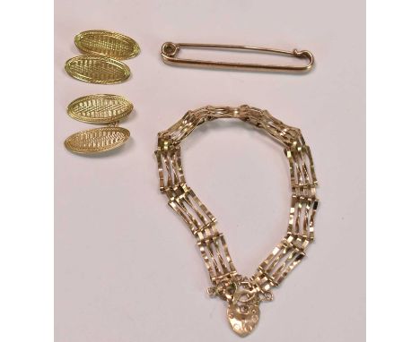 A pair of 18ct yellow gold cufflinks with engraved oval platforms, approx 4.8g, also a 9ct yellow gold four bar gate link bra