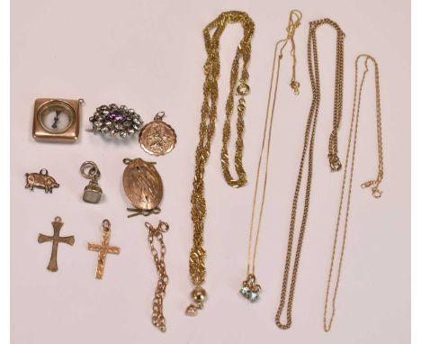 Two 9ct yellow gold cross pendants, a 9ct rose gold circular pendant (combined approx 4.48g), a compass set pendant, two base