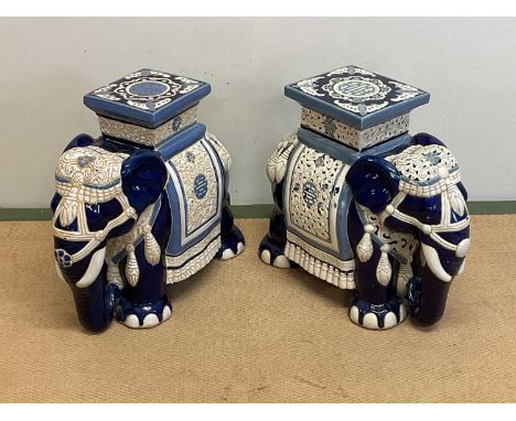 A pair of decorative ceramic pot stands in the form of elephants with ceremonial decoration, height 44cm, width 23cm, depth 5