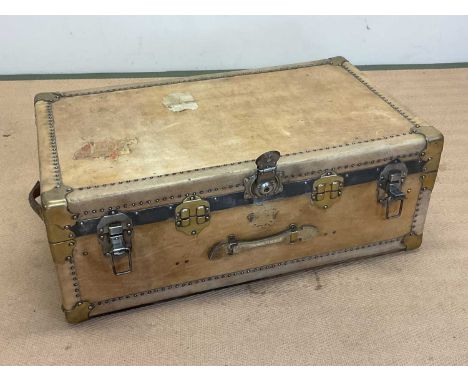 An early 20th century vellum travel trunk with fitted interior, height 35cm, width 92cm, depth 54cm.