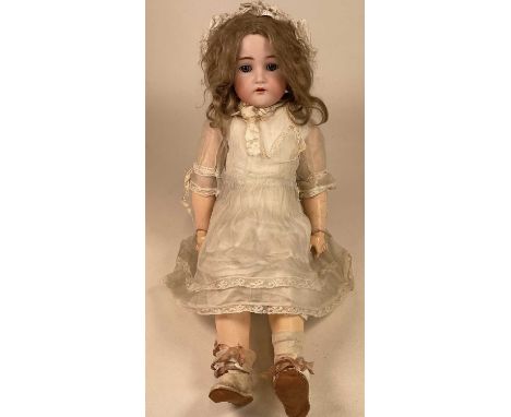 SIMON &amp; HALBIG FOR KRAMER &amp; REINHARDT; an early 20th century doll, with bisque socket head, sleeping blue eyes (lacki