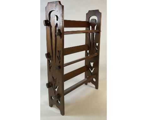 An Arts and Crafts oak three shelf open bookcase, with tulip shaped cuts outs to sides and peg jointed shelves, 85 x 61 x18cm