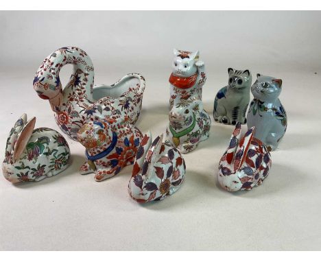 A collection of Imari style 20th century porcelain animals including a swan bowl, height 21cm, rabbits, and two decorative ce