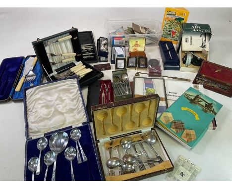 A group of collectors' items including three boxed Zippo lighters, fishing reel, silver plated items, etc.