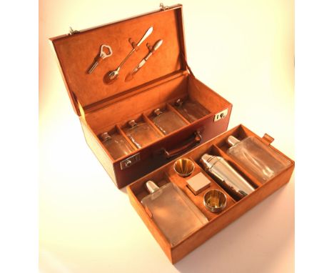 A rare German 1920s four person cocktail or drinks set, the leather case opens to reveal a fully fitted interior, retaining t