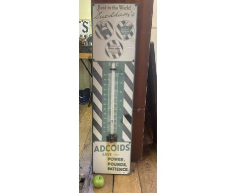 An enamel forecourt thermometer, Duckham's Adcoids, lacks thermometer and a little faded, 115 x 28 cm 