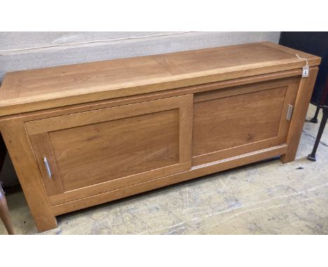 A contemporary light oak sliding door sideboard, length 178cm, depth 50cm, height 78cm