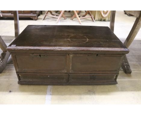 An 18th century oak trunk with dummy drawer front, width 92cm, depth 53cm, height 39cm