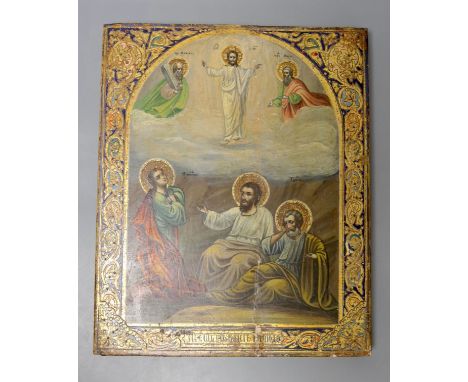 A Russian Icon, painted and gilt gesso panel, of six figures within an arched vignette