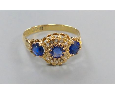 A George V 18ct gold, sapphire and diamond chip cluster dress ring, size R/S, gross 2.7 grams.