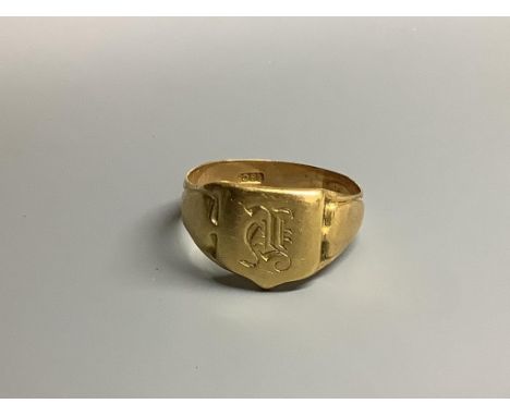 An Edwardian 18ct signet ring with engraved initial and inscription, size S/T,6.7 grams.