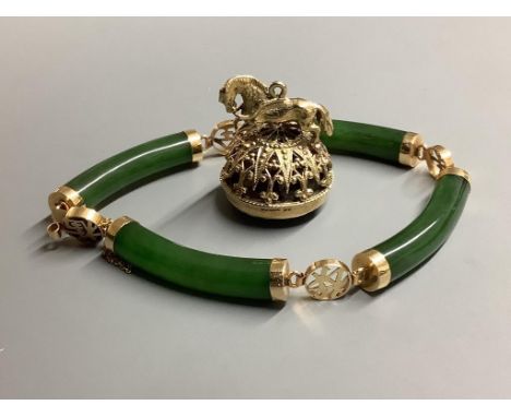 A modern 14 K yellow metal and nephrite set bracelet and a modern 9 carat gold and quartz set fob seal.
