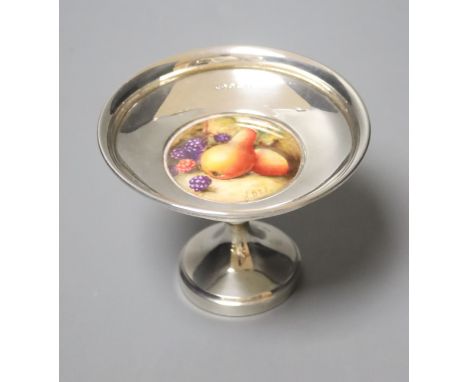 A George V silver pedestal nut dish, with inset Royal Worcester plaque, signed W. Bee, height 74mm, weighted.