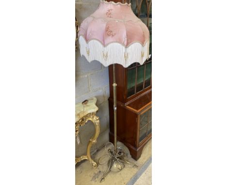 An Art Nouveau brass telescopic standard lamp