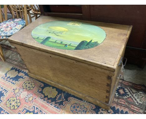 A Victorian stripped pine trunk, the top later painted with an airship scene, length 89cm, depth 37cm, height 50cm