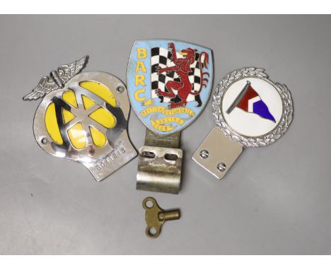 A British Automobile Racing Club car badge, an AA badge and one other