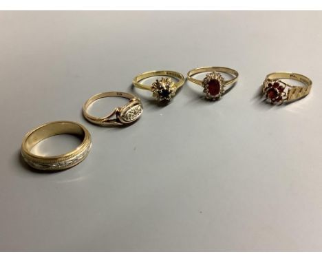 An 18ct gold, sapphire and diamond ring, gross 3.2 grams and four 9ct gold rings, two gem-set, gross 10 grams.