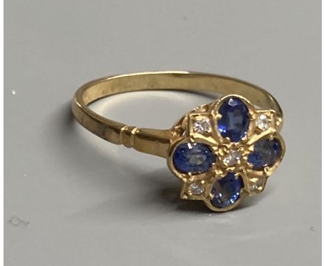 A modern 9ct gold, sapphire and diamond cluster ring, size O, gross 2.2 grams.