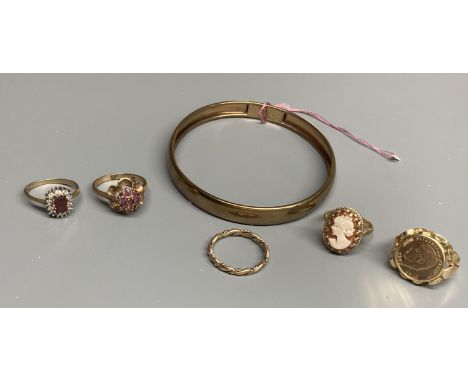 Four assorted modern 9ct gold and gem set rings and a 375 bangle, gross 18 grams and a 585 ring, gross 3.5 grams.