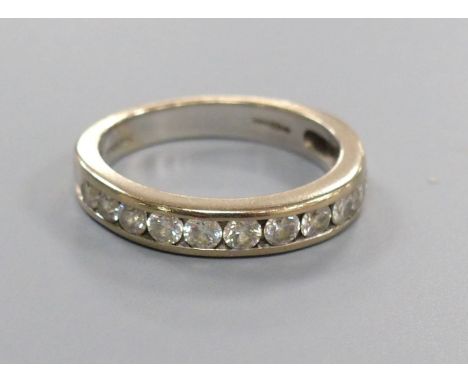 A diamond and 18ct white gold half eternity ring, size M, gross 4.5 grams.