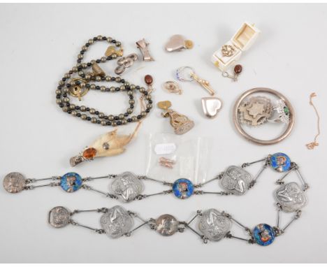 Items of vintage jewellery, two seals, a white metal Egyptian belt with enamel decoration, a necklace fastener, silver medall