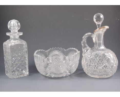 A cut glass claret jug with silver rim, hallmarked Birmingham 1900, 27cm, a whisky decanter 26cm and a cut glass fruit bowl w