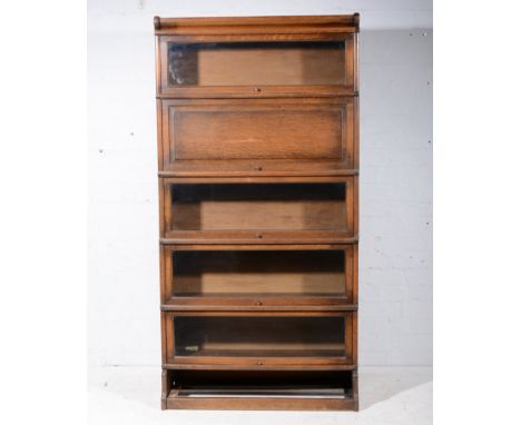 Globe Wernicke type oak five heights sectional bookcase, with four glazed panelled flaps, lacking plinth drawer, width 87cm, 